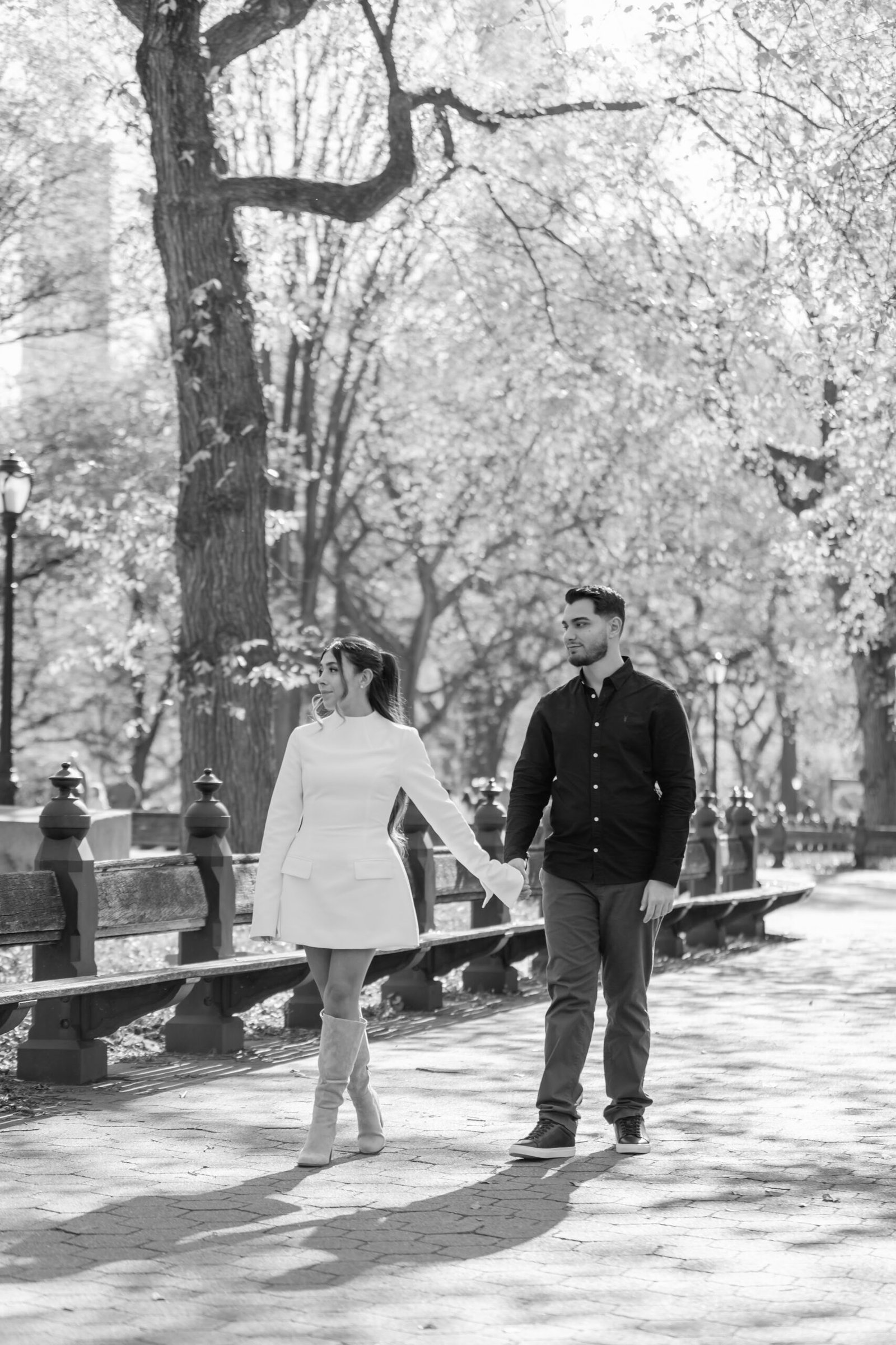 Couple walking together through the park