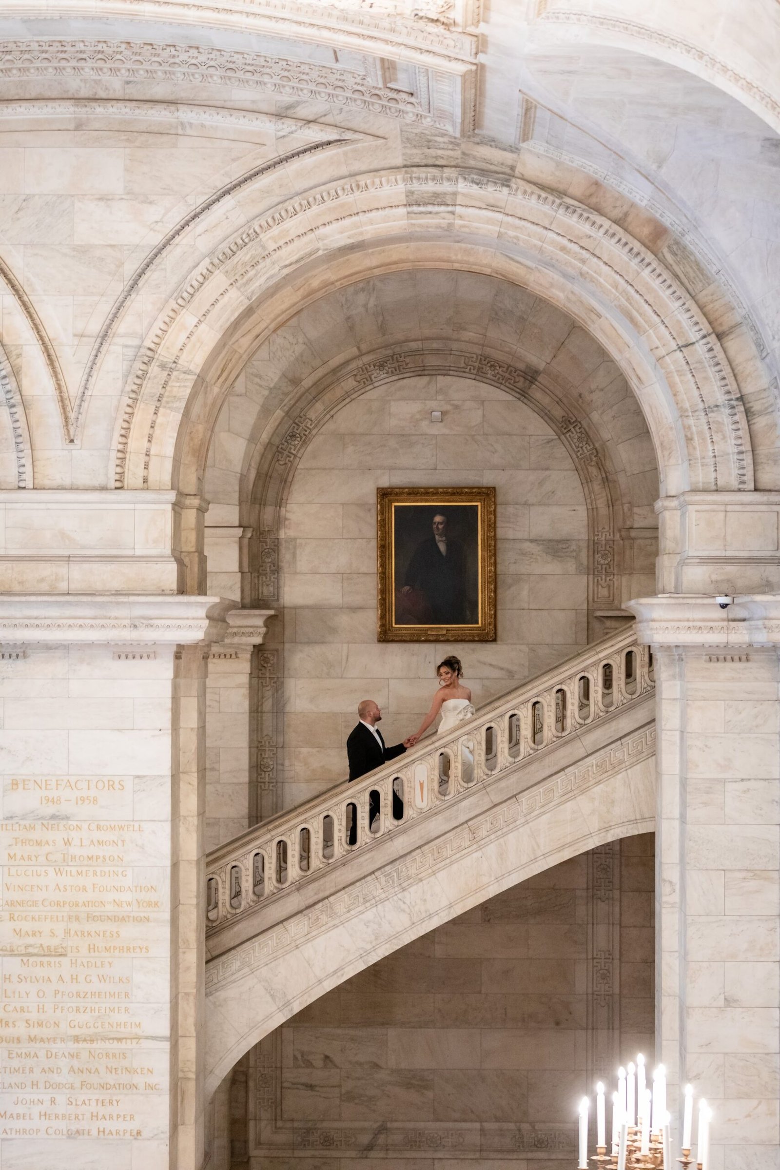Couple on the grand marble staircase of the public library
