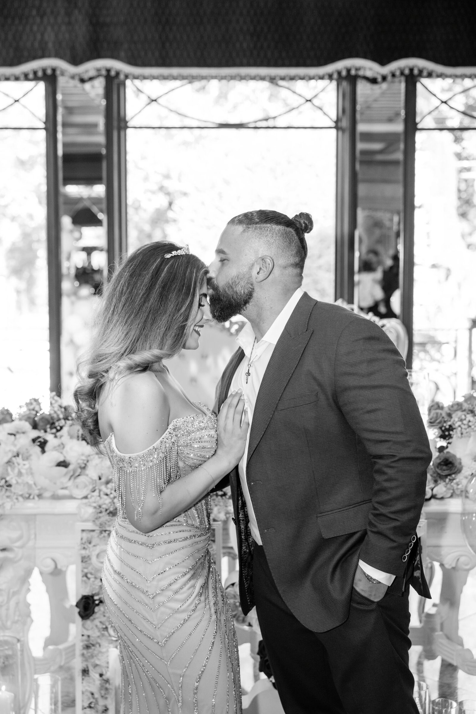 Couple sharing a kiss at their engagement party