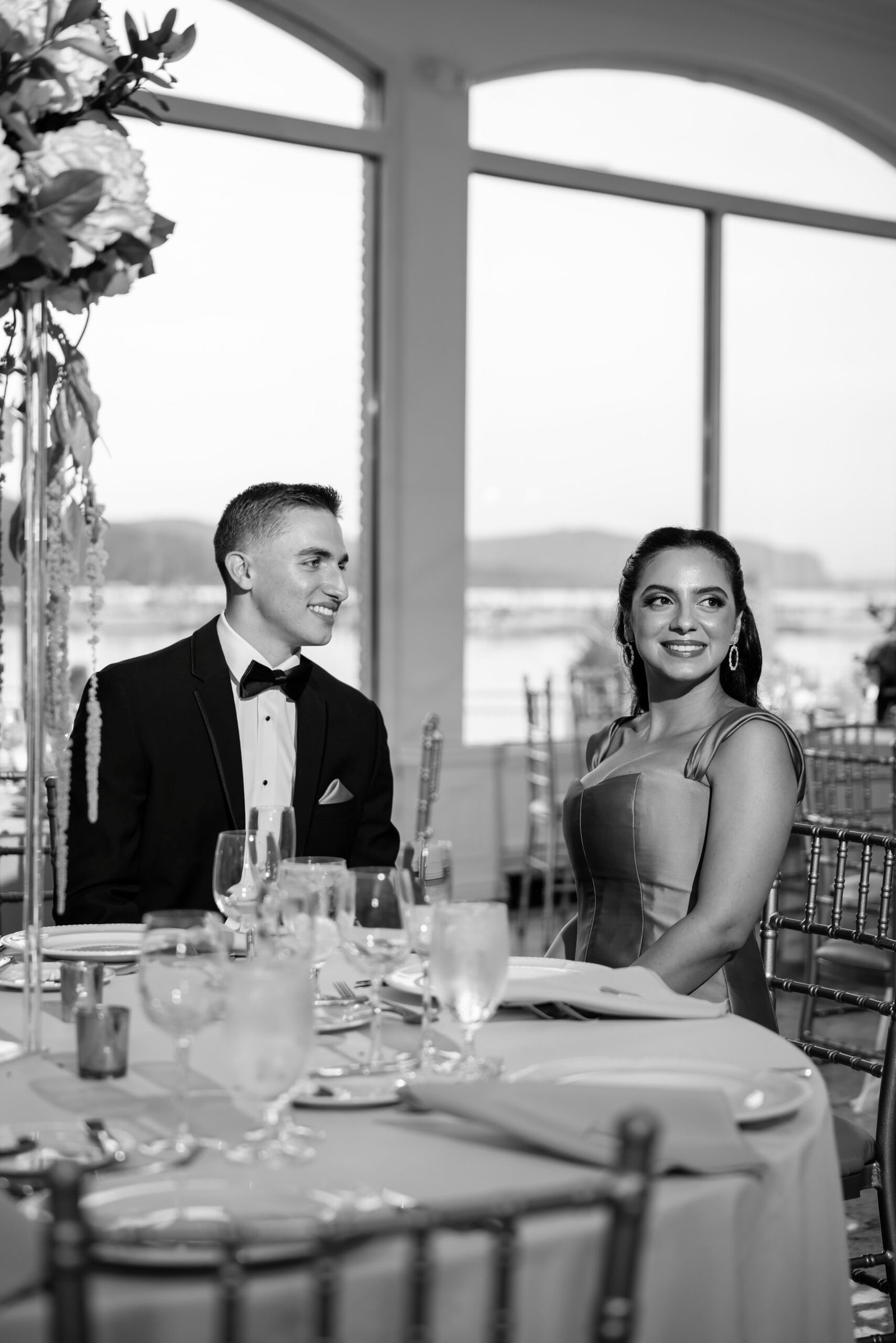 Black and white photograph of the couple at the dinner table