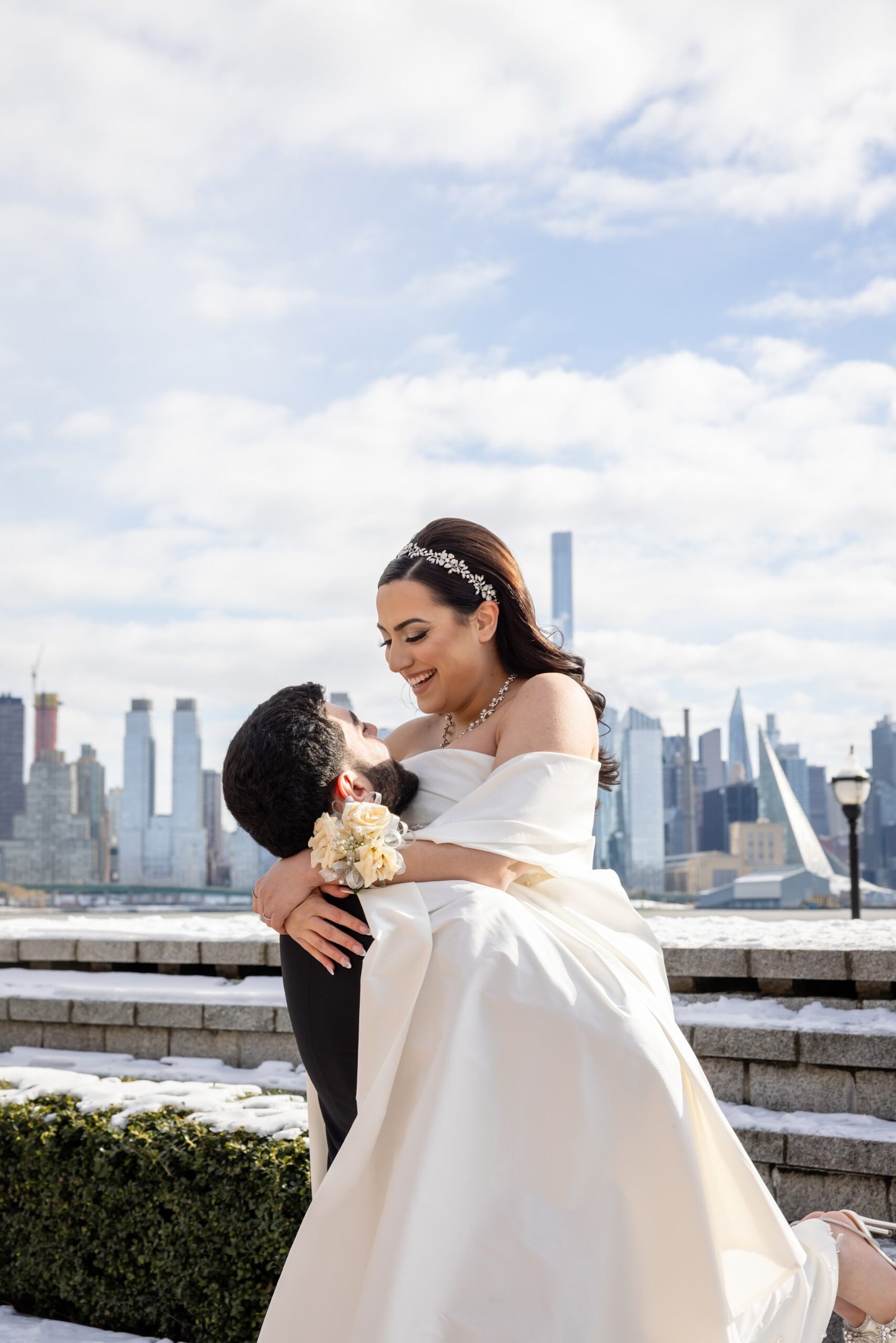 Couple embracing on a rooftop above the city