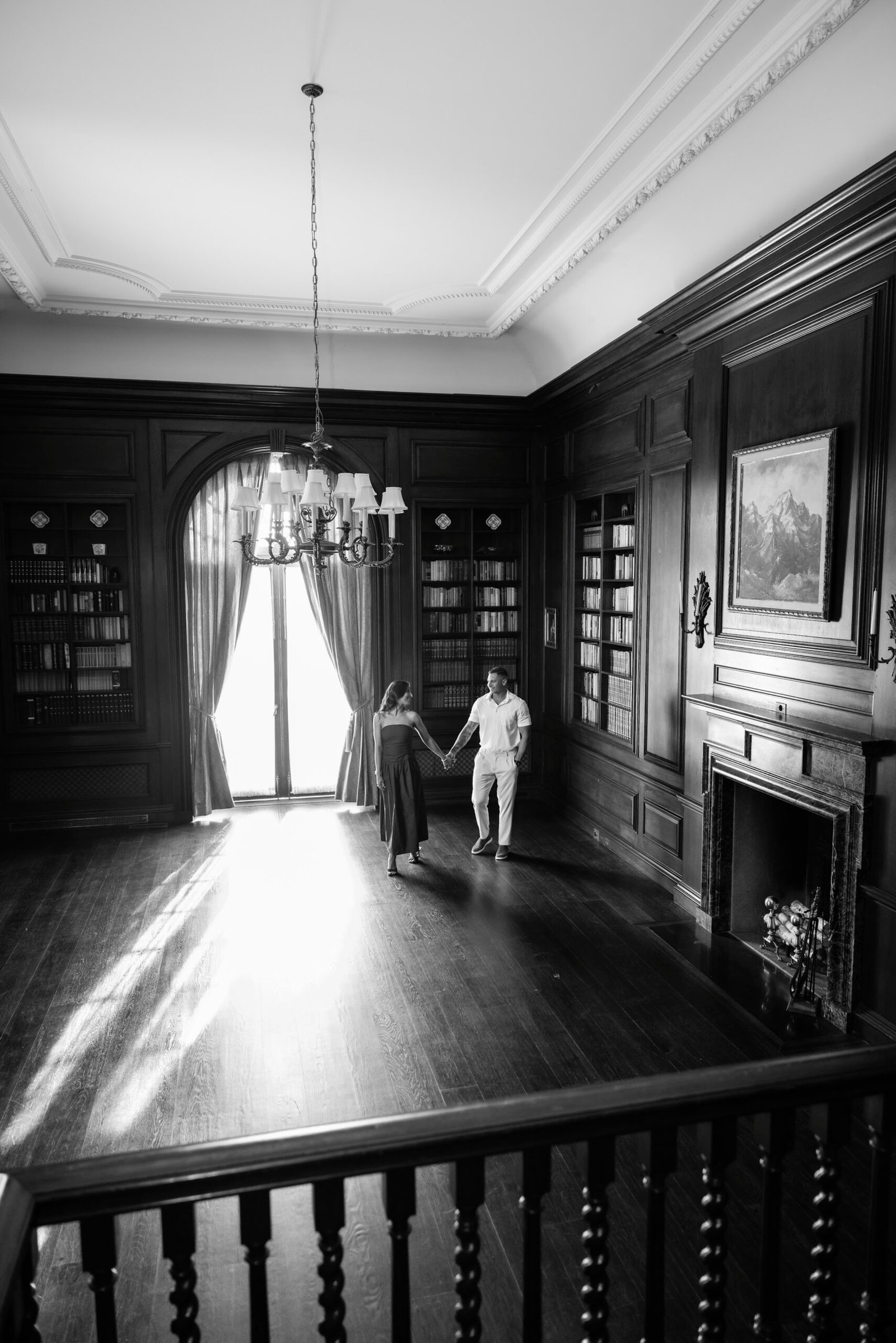 Black and white photograph of the proposal in a grand room