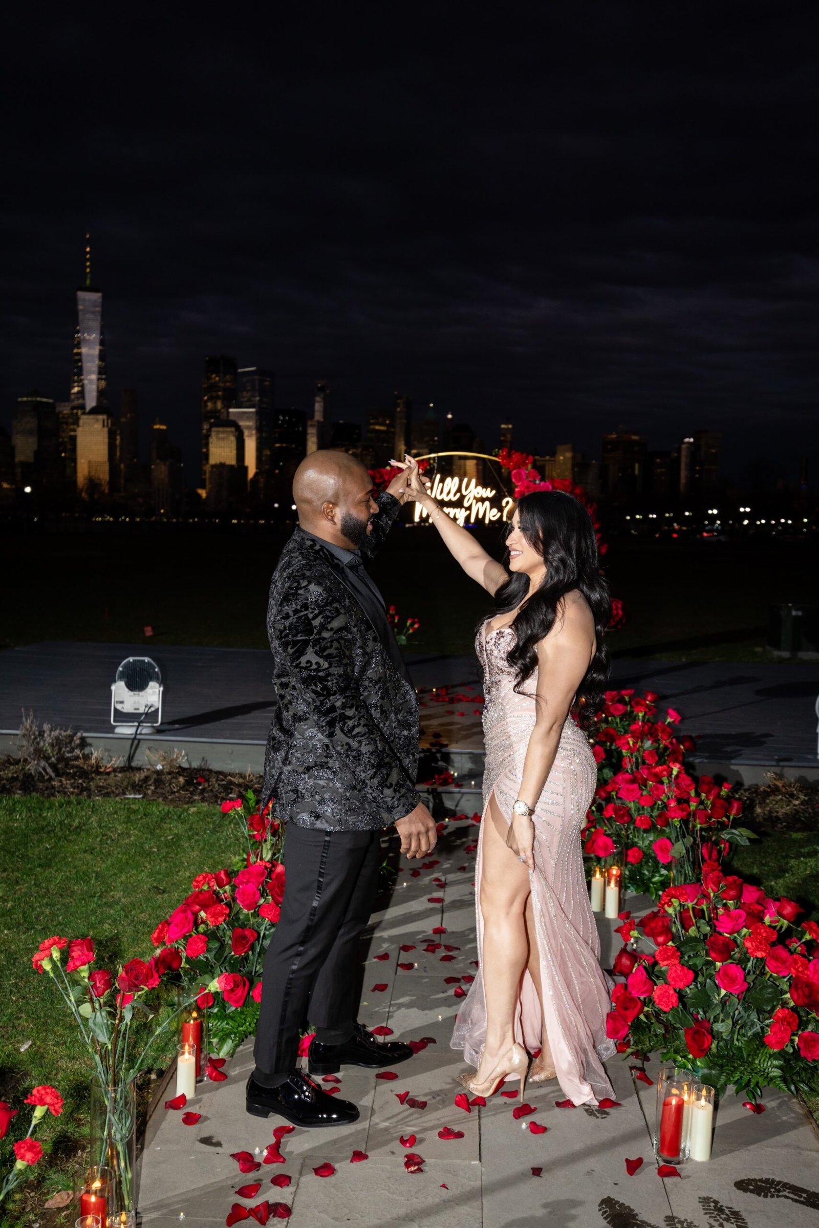 Night time proposal with the city skyline behind
