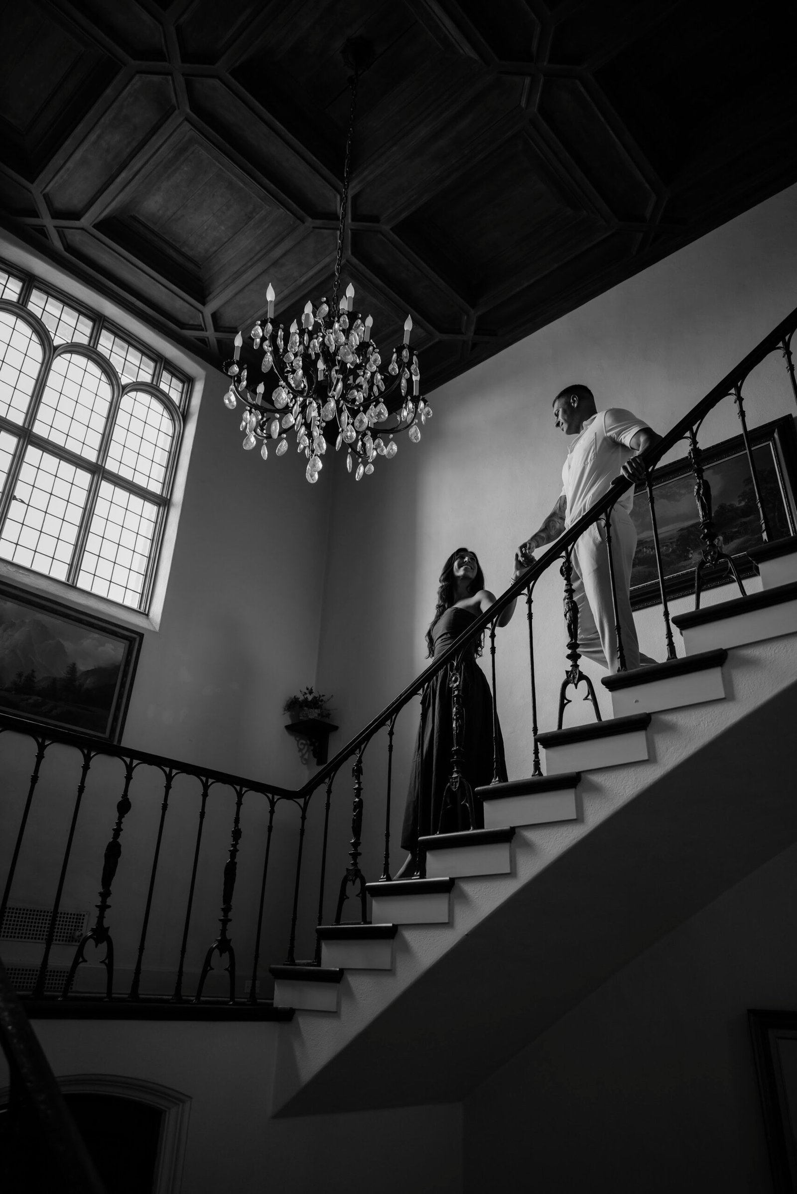 Black and white photograph of the proposal on a grand staircase