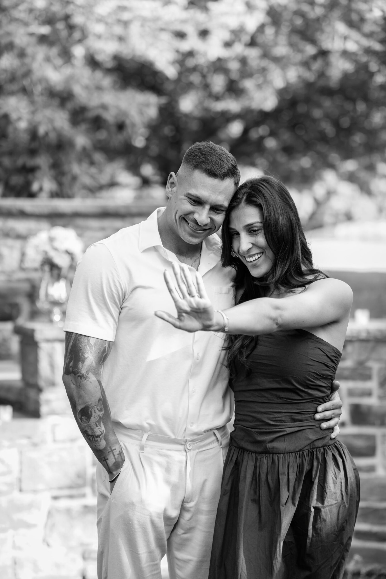 Couple showing the engagement ring after saying yes
