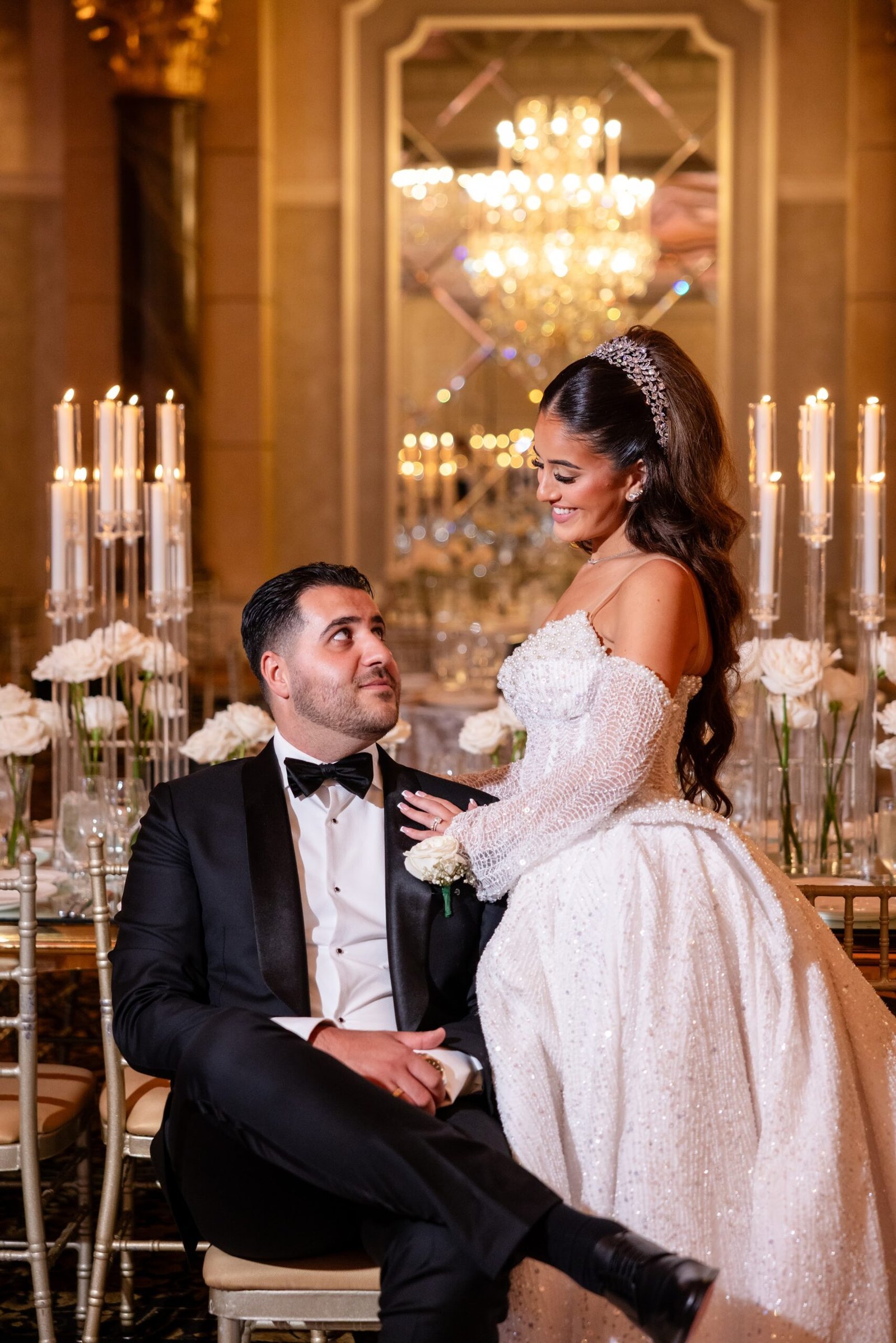Bride and groom at their candlelit reception table