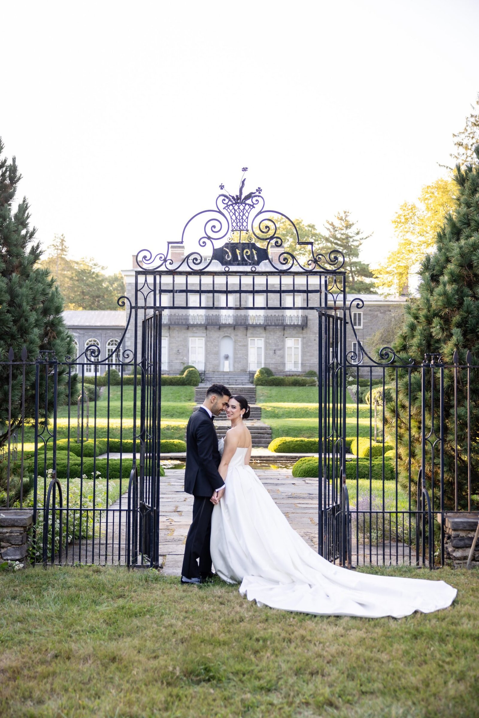 Bride and groom at the estate gates